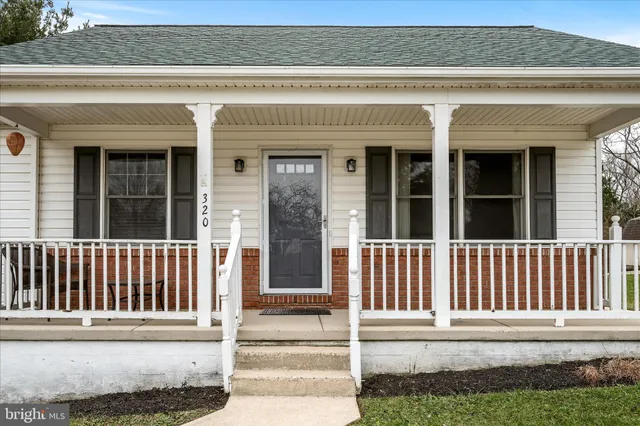 a view of a house with a small yard