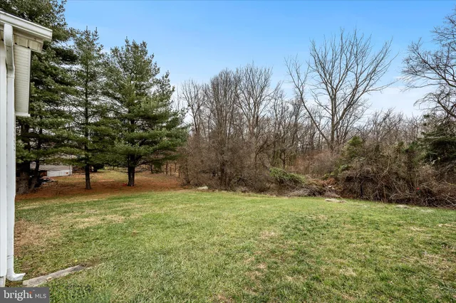 a backyard of a house with lots of green space
