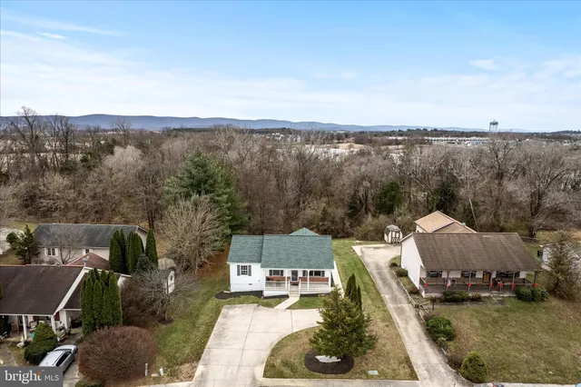 a view of a swimming pool and lounge chairs