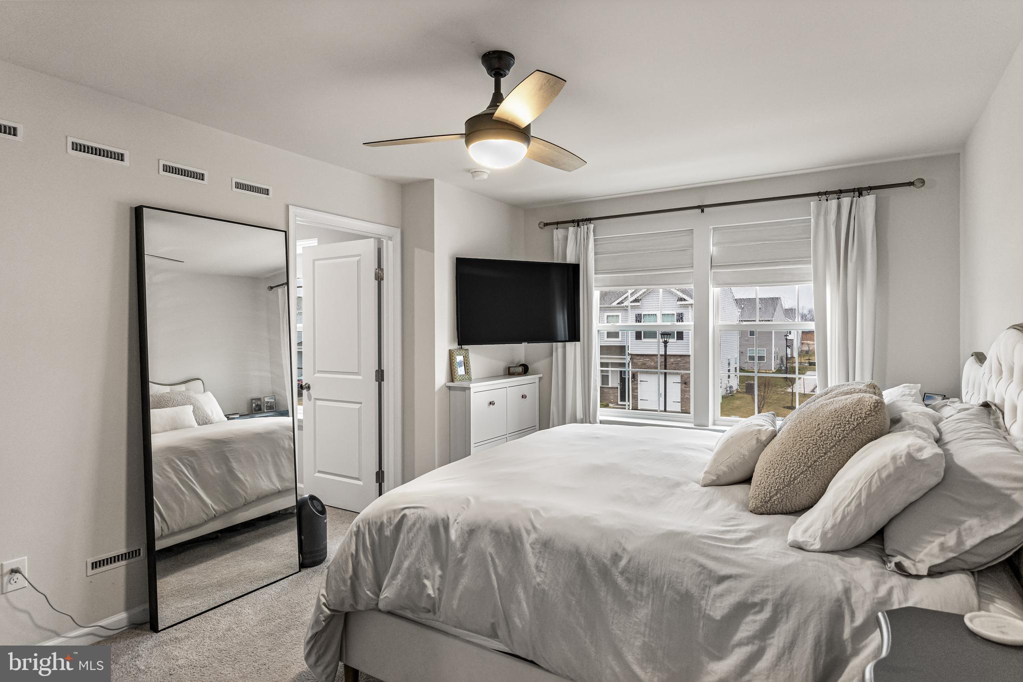 60 Nelsons Way Westampton, NJ 08060 - Photo 18 of 29 a bedroom with a bed window and a flat screen tv