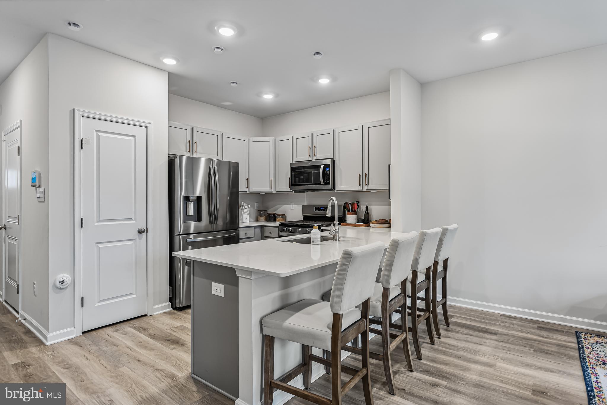 60 Nelsons Way Westampton, NJ 08060 - Photo 9 of 29 a kitchen with refrigerator a sink and chairs