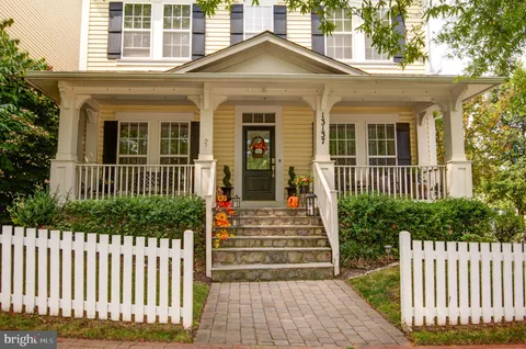 a front view of a house with tree s