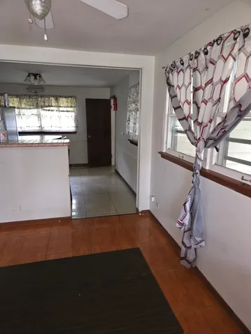 a view of a room with gym equipment and a window
