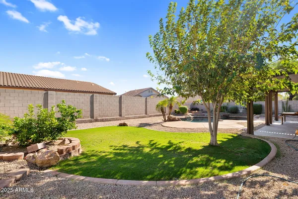a swimming pool with yard in front of it