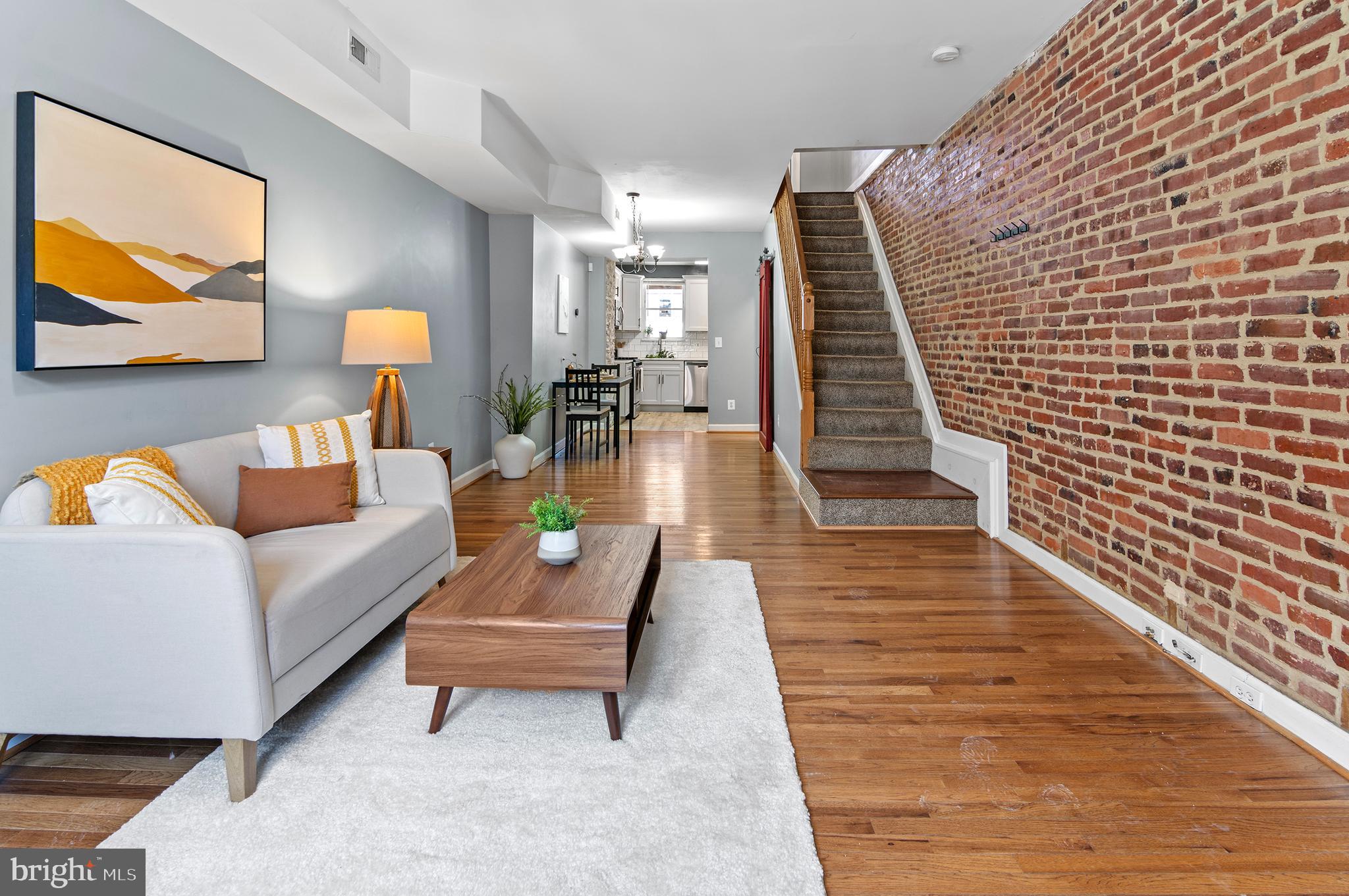 416 South Bouldin Street Baltimore, MD 21224 - Photo 2 of 45 a living room with furniture and wooden floor