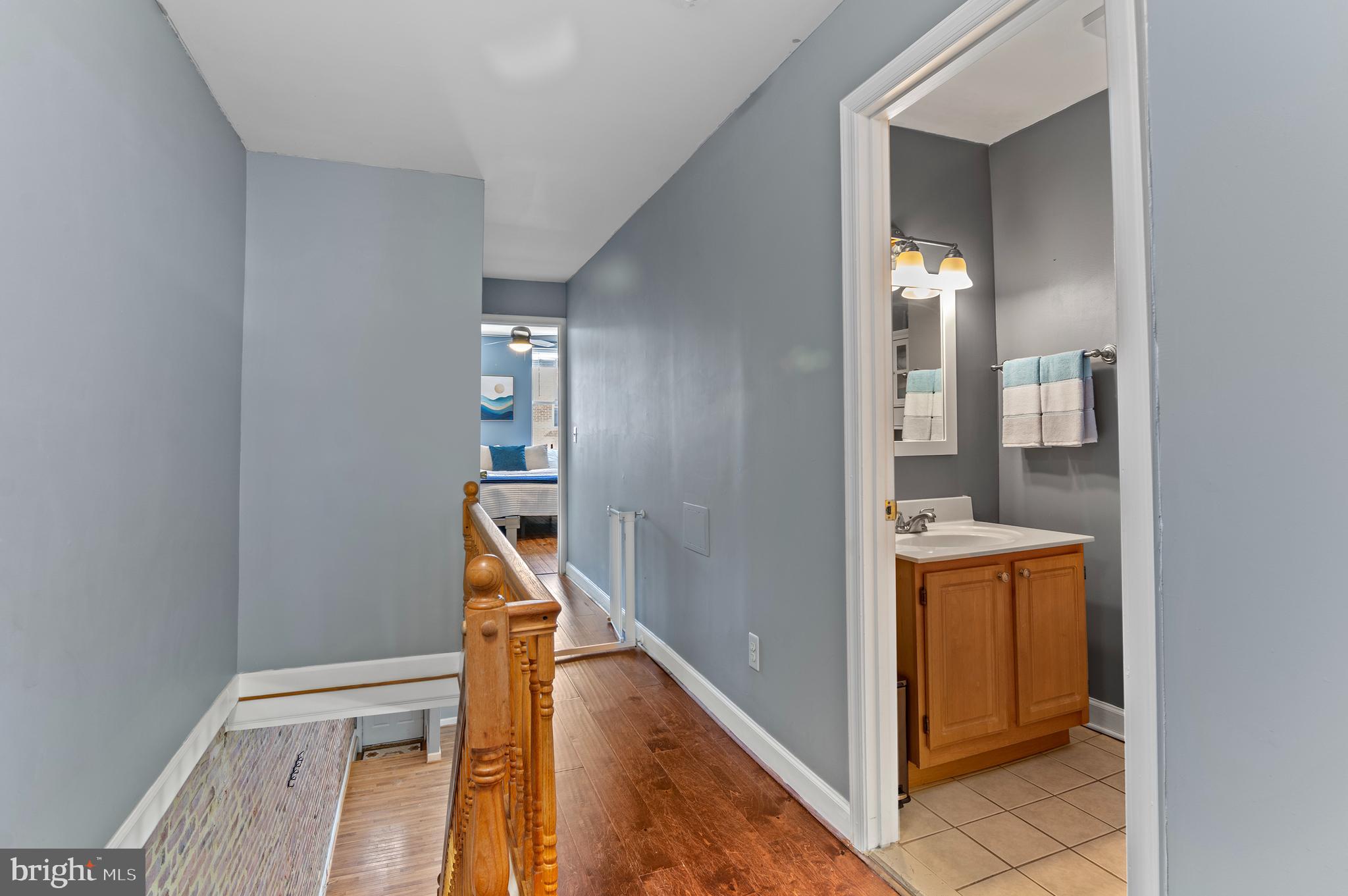 416 South Bouldin Street Baltimore, MD 21224 - Photo 21 of 45 a view of an entryway with wooden floor and a bathroom
