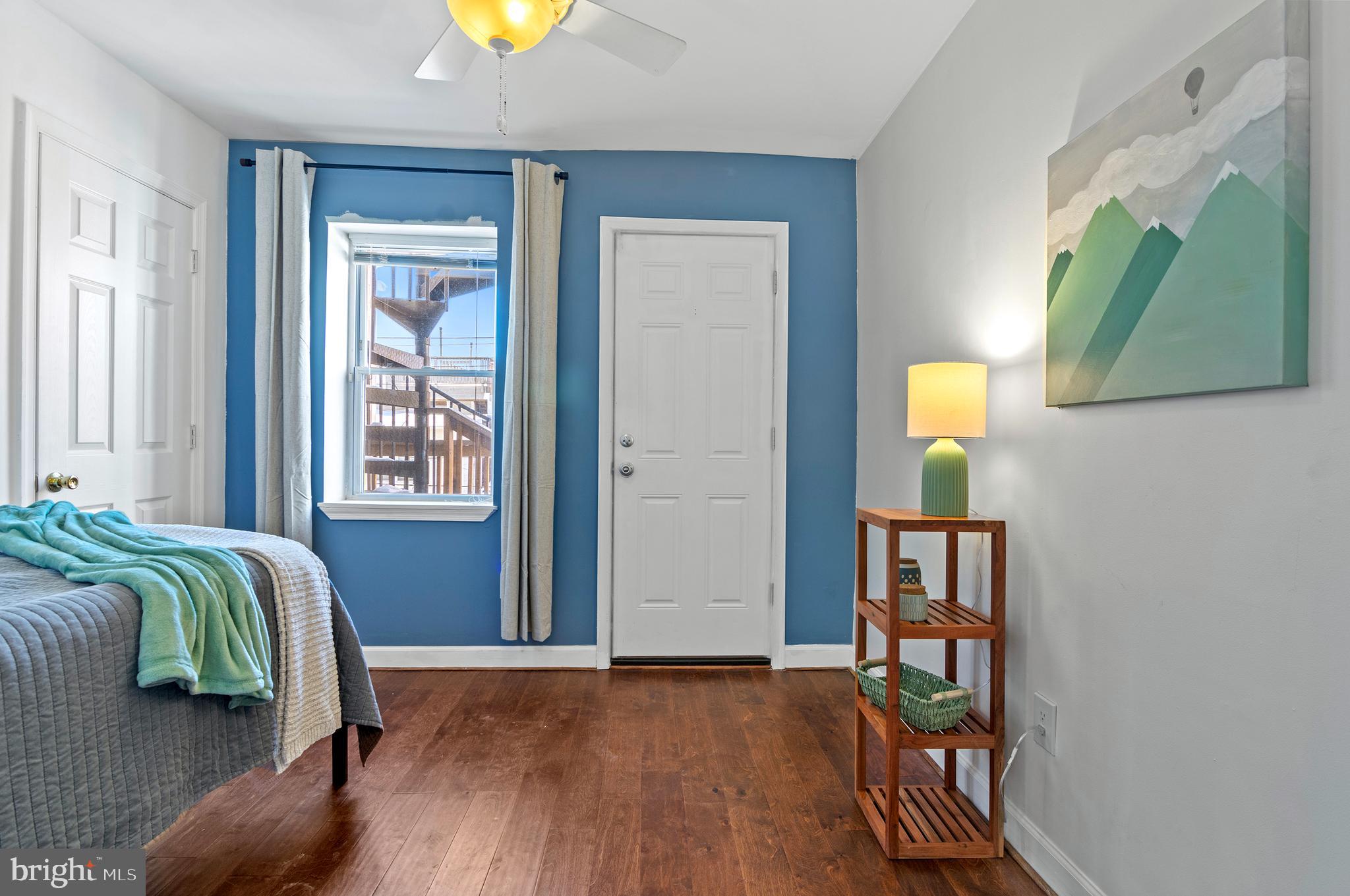 416 South Bouldin Street Baltimore, MD 21224 - Photo 22 of 45 a view of a bedroom with a bed and a window