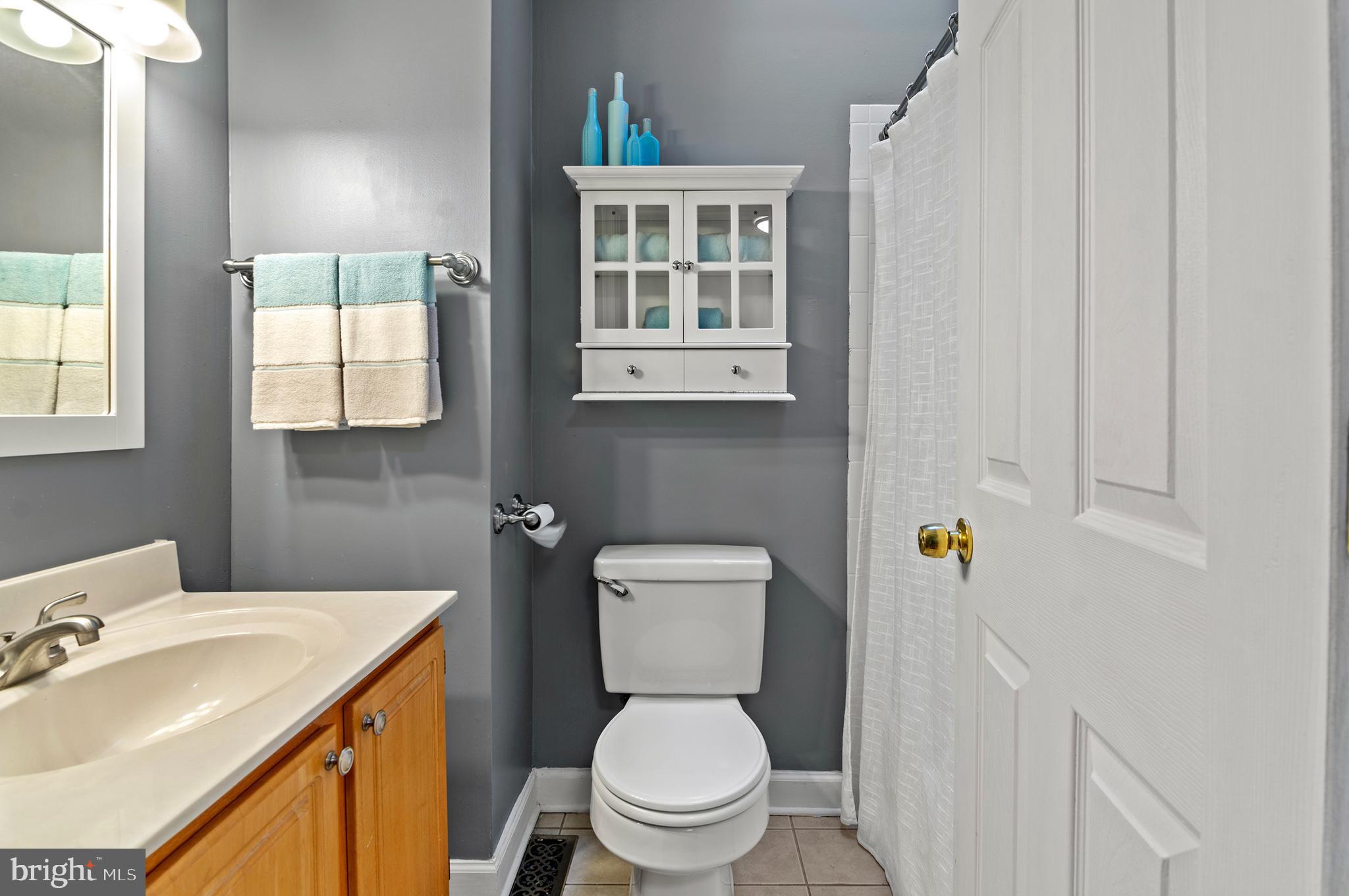 416 South Bouldin Street Baltimore, MD 21224 - Photo 26 of 45 a bathroom with a toilet sink and mirror