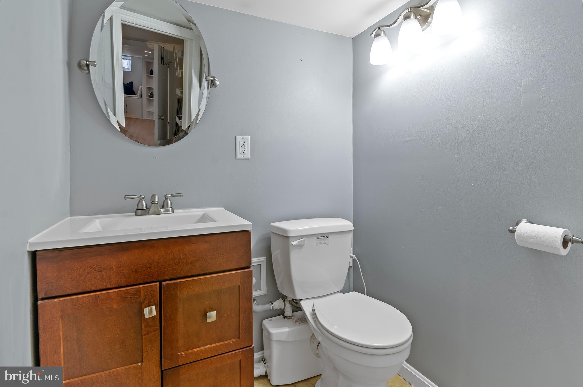 416 South Bouldin Street Baltimore, MD 21224 - Photo 41 of 45 a bathroom with a toilet sink and mirror