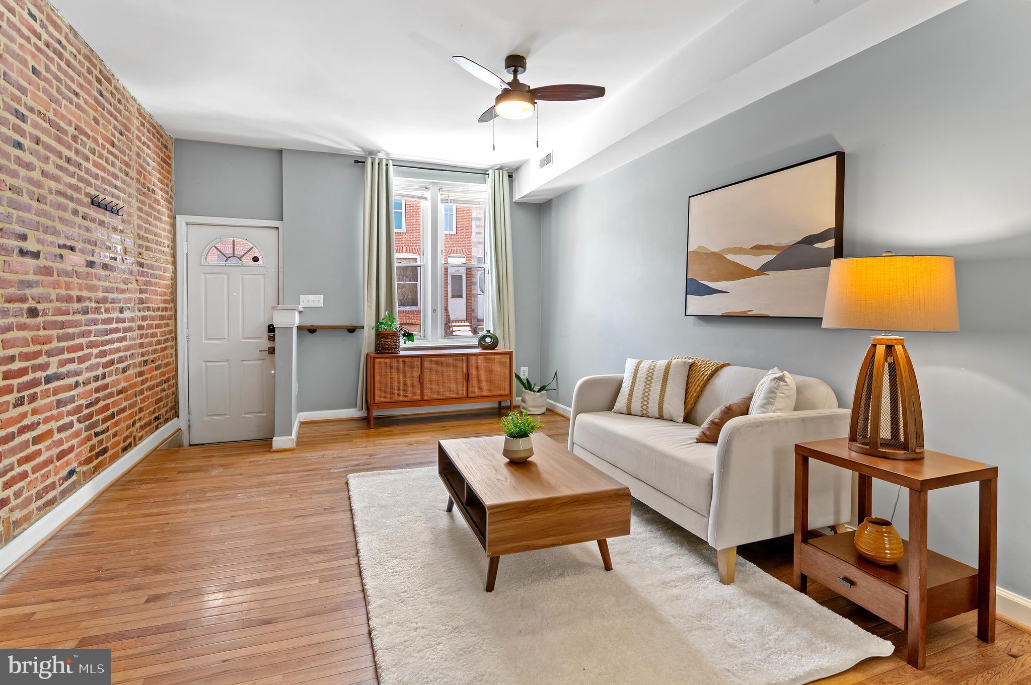 416 South Bouldin Street Baltimore, MD 21224 - Photo 6 of 45 a living room with furniture and a lamp