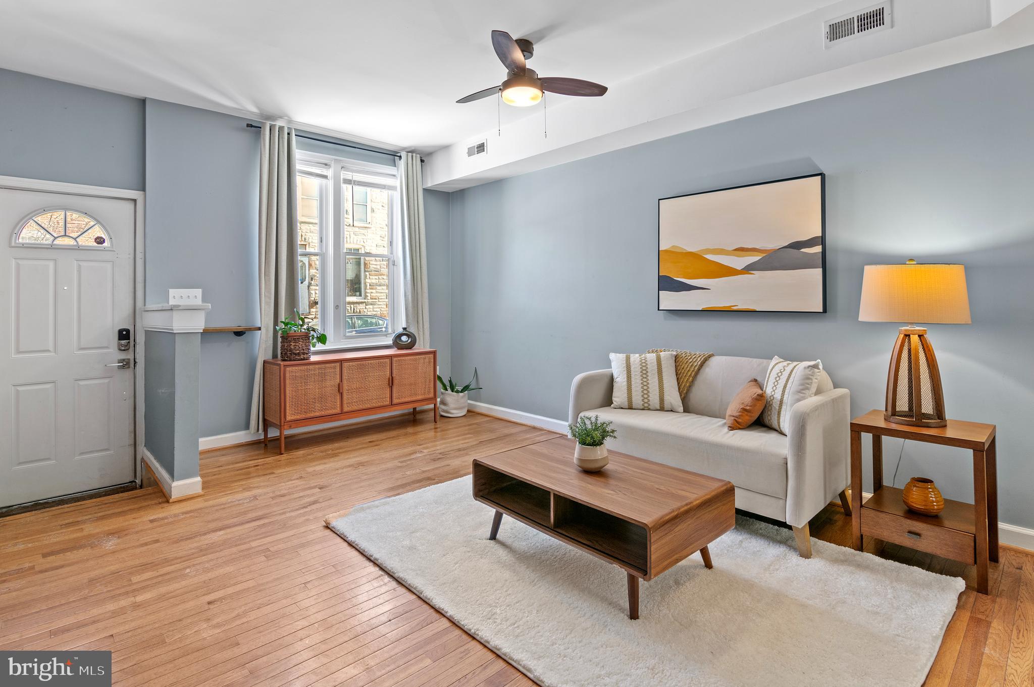 416 South Bouldin Street Baltimore, MD 21224 - Photo 7 of 45 a living room with furniture and a potted plant