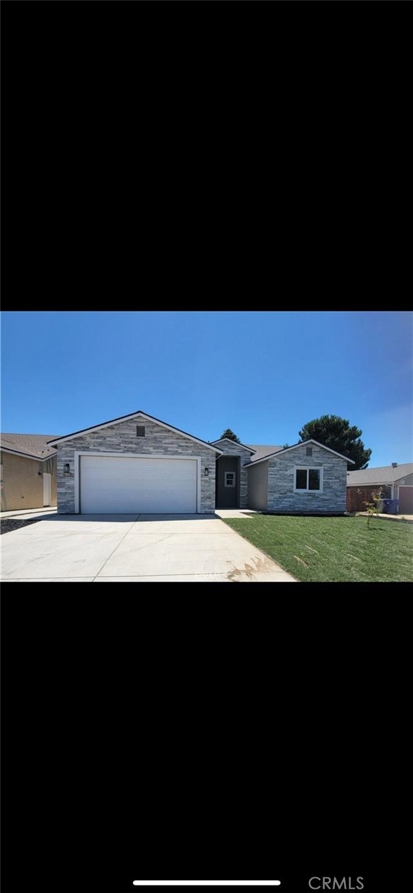 a view of kitchen with kitchen island stainless steel appliances a sink and a stove