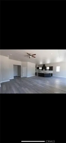 a view of kitchen island with stainless steel appliances