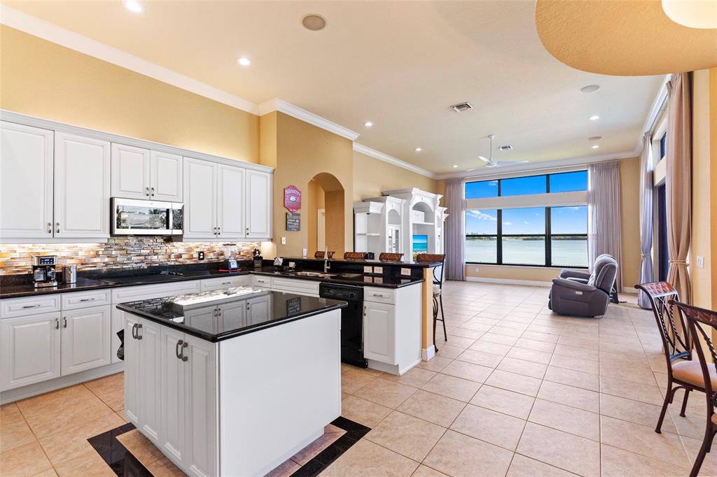 18622 Southwest 41st Street Miramar, FL 33029 - Photo 11 of 63 a kitchen with a sink a stove and cabinets