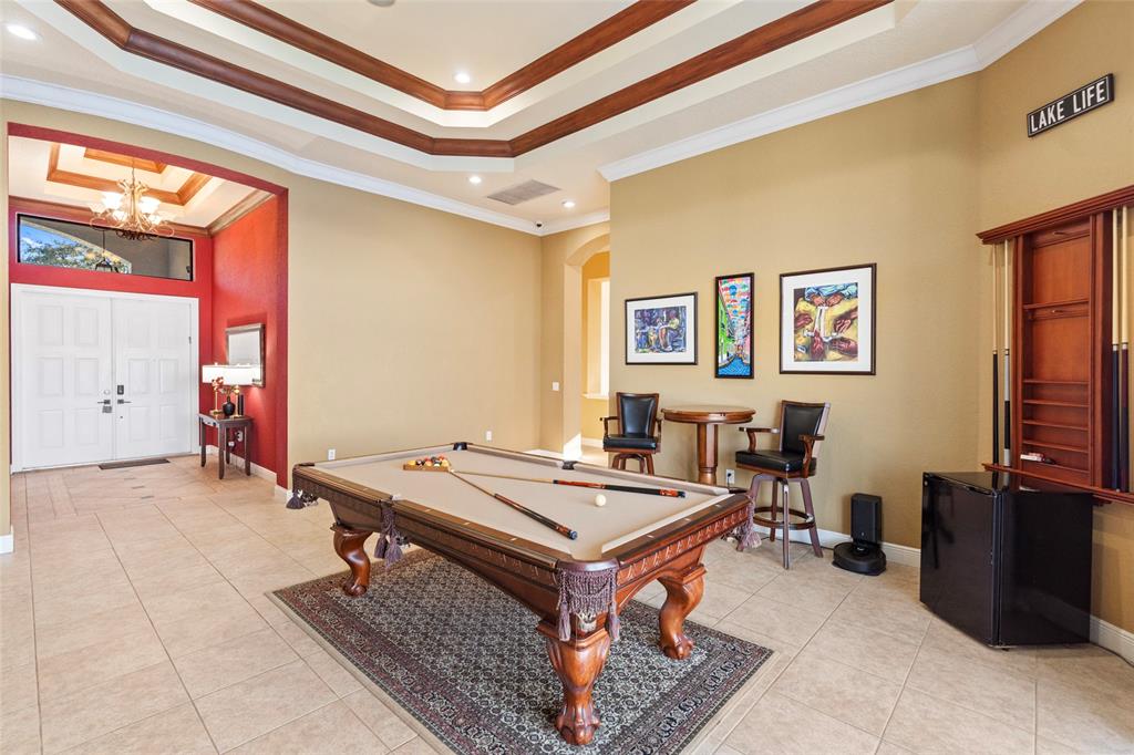 18622 Southwest 41st Street Miramar, FL 33029 - Photo 19 of 63 a living room with a table and a dresser next to a window