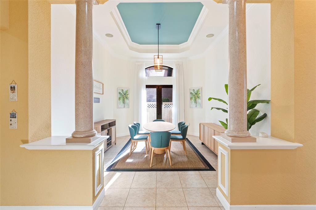 18622 Southwest 41st Street Miramar, FL 33029 - Photo 23 of 63 a dining room with table chairs and a chandelier