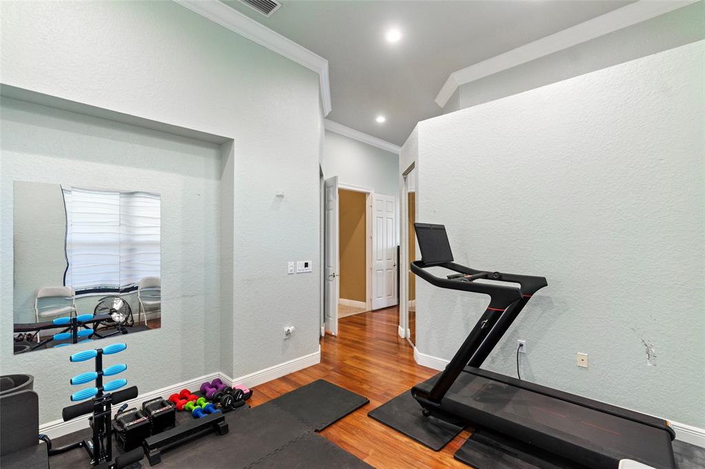 18622 Southwest 41st Street Miramar, FL 33029 - Photo 30 of 63 a room with gym equipment