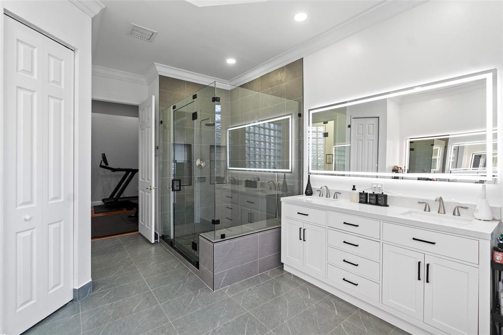 18622 Southwest 41st Street Miramar, FL 33029 - Photo 33 of 63 a bathroom with a double vanity sink mirror double shower and tub