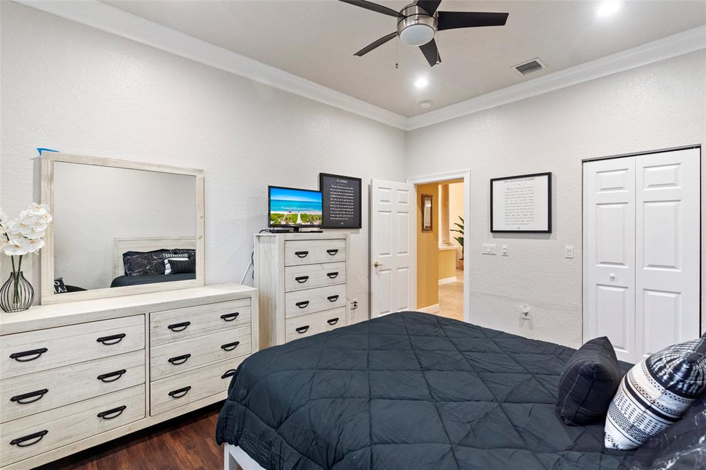 18622 Southwest 41st Street Miramar, FL 33029 - Photo 37 of 63 a bedroom with a bed and a dresser