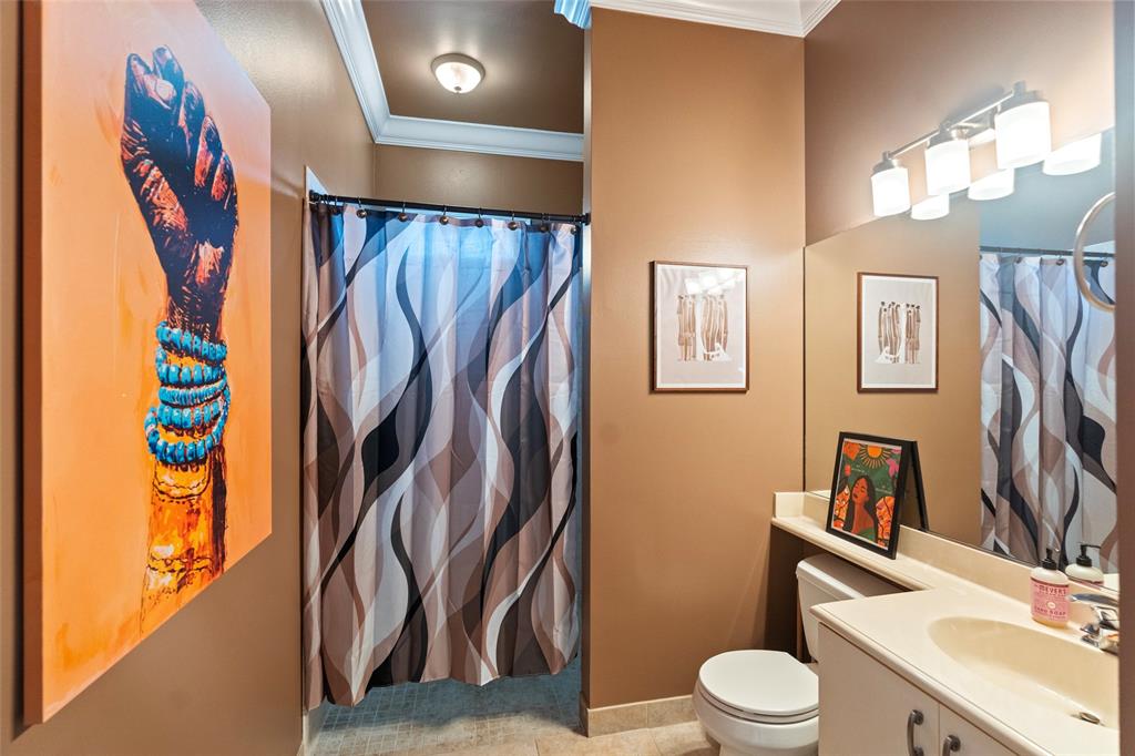 18622 Southwest 41st Street Miramar, FL 33029 - Photo 42 of 63 a bathroom with a toilet sink and shower curtain