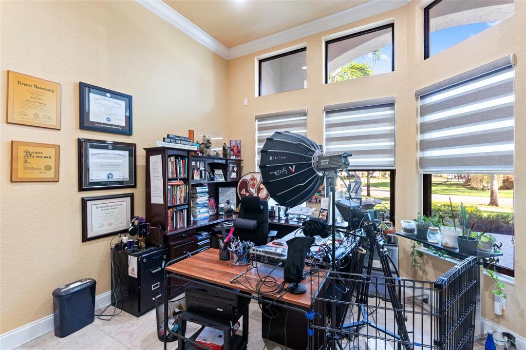 18622 Southwest 41st Street Miramar, FL 33029 - Photo 43 of 63 a room with furniture and a book shelf
