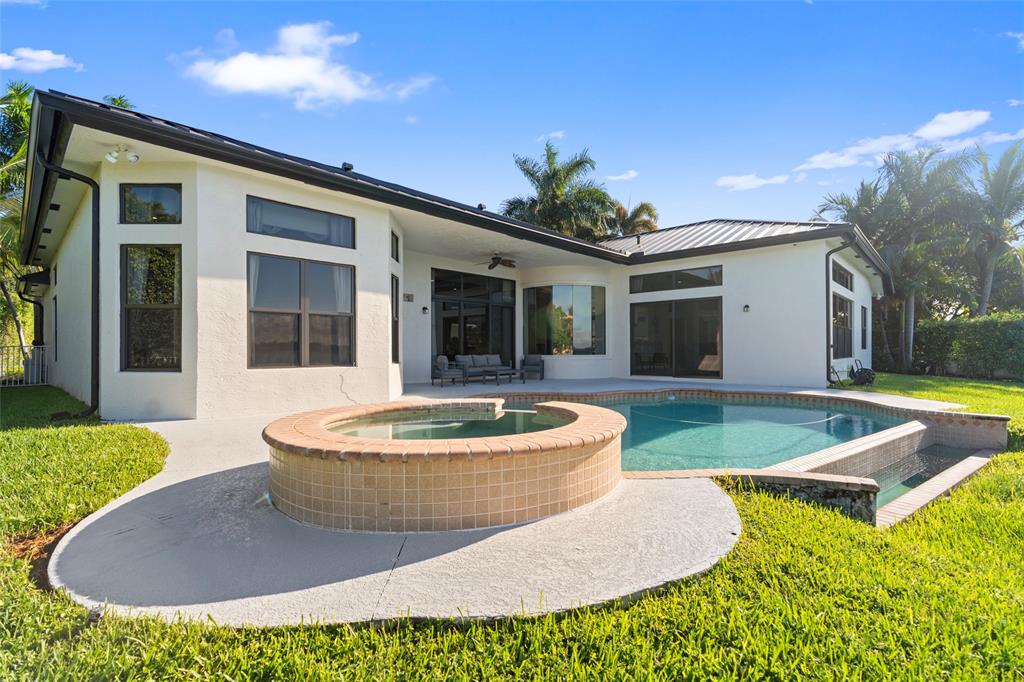 18622 Southwest 41st Street Miramar, FL 33029 - Photo 44 of 63 a view of an house with swimming pool and porch