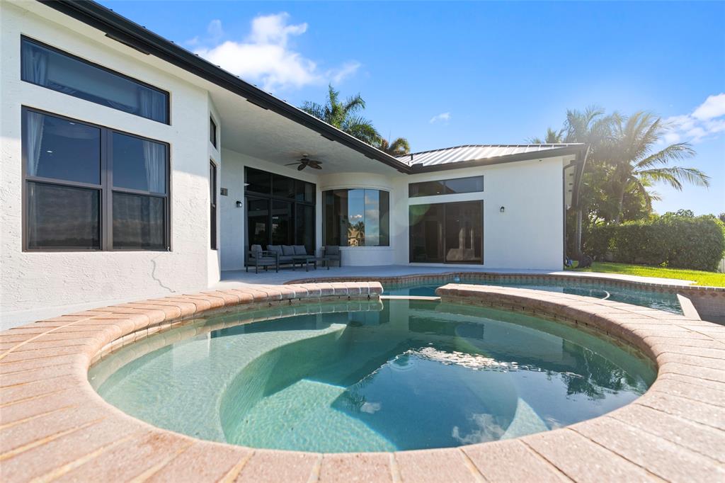 18622 Southwest 41st Street Miramar, FL 33029 - Photo 45 of 63 a view of a house with swimming pool and a porch