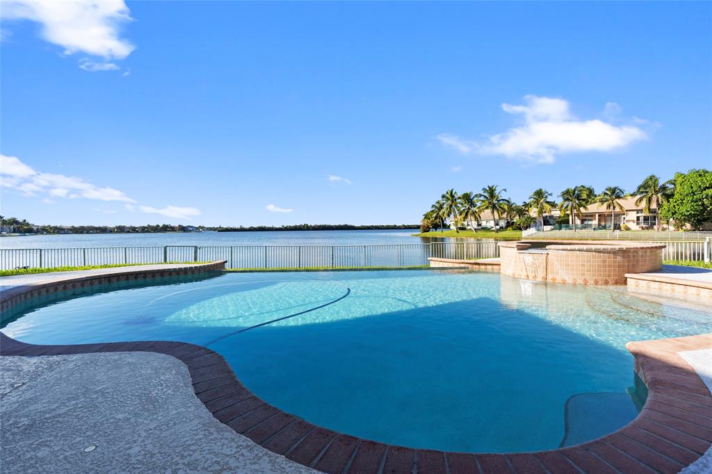 18622 Southwest 41st Street Miramar, FL 33029 - Photo 7 of 63 a view of a swimming pool with an ocean view