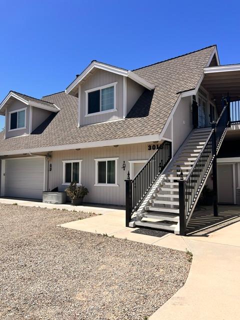 3019 Lathrop Road Manteca, CA 95336 - Photo 14 of 43 a front view of a house with wooden stairs