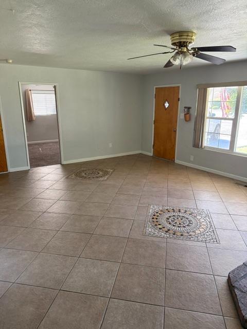 3019 Lathrop Road Manteca, CA 95336 - Photo 15 of 43 a view of a livingroom with a chandelier fan and windows