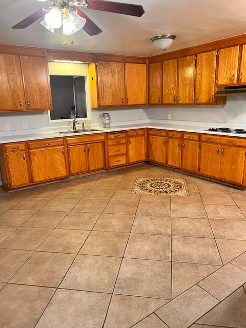 3019 Lathrop Road Manteca, CA 95336 - Photo 16 of 43 a kitchen with granite countertop a stove a sink and a cabinets