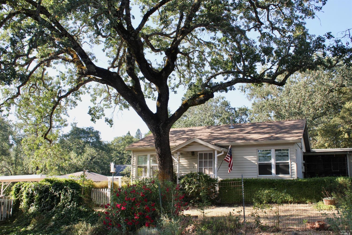 490 Cornish Lane Angwin, CA 94508 - Photo 1 of 1 a view of a house with a tree in front