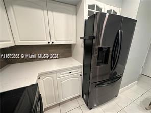 16520 Bridge End Road Miami Lakes, FL 33014 - Photo 5 of 20 a kitchen with stainless steel appliances a refrigerator and cabinets