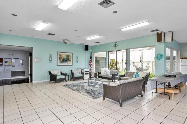 a view of a dining room with furniture and a livingroom