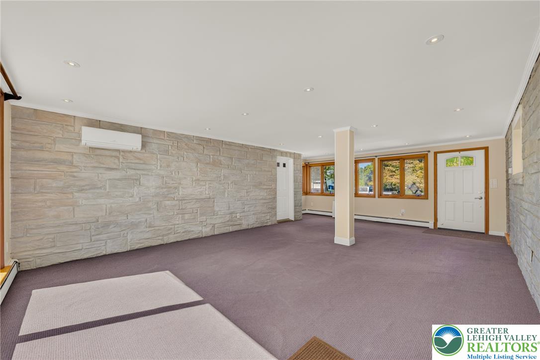 1814 Ruth Street Allentown, PA 18104 - Photo 24 of 54 Textured stone accent walls and recessed lighting define this expansive lower level space.
