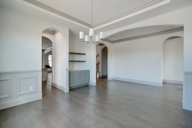 wooden floor in an empty room with a fireplace