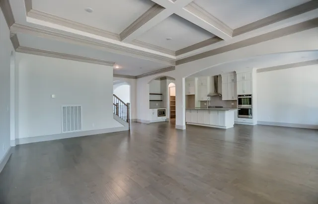 a view of an empty room with a fireplace