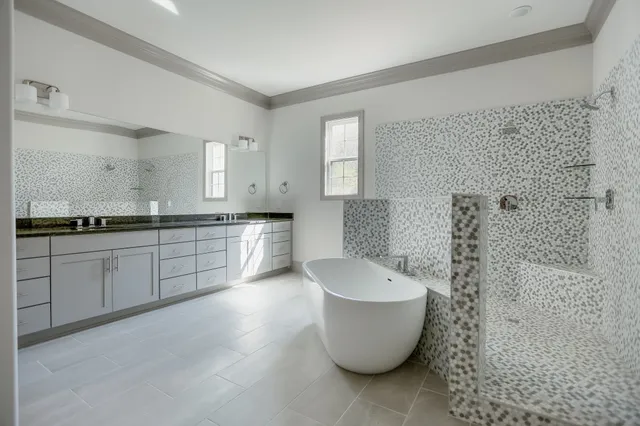 a bathroom with a sink double vanity and a mirror
