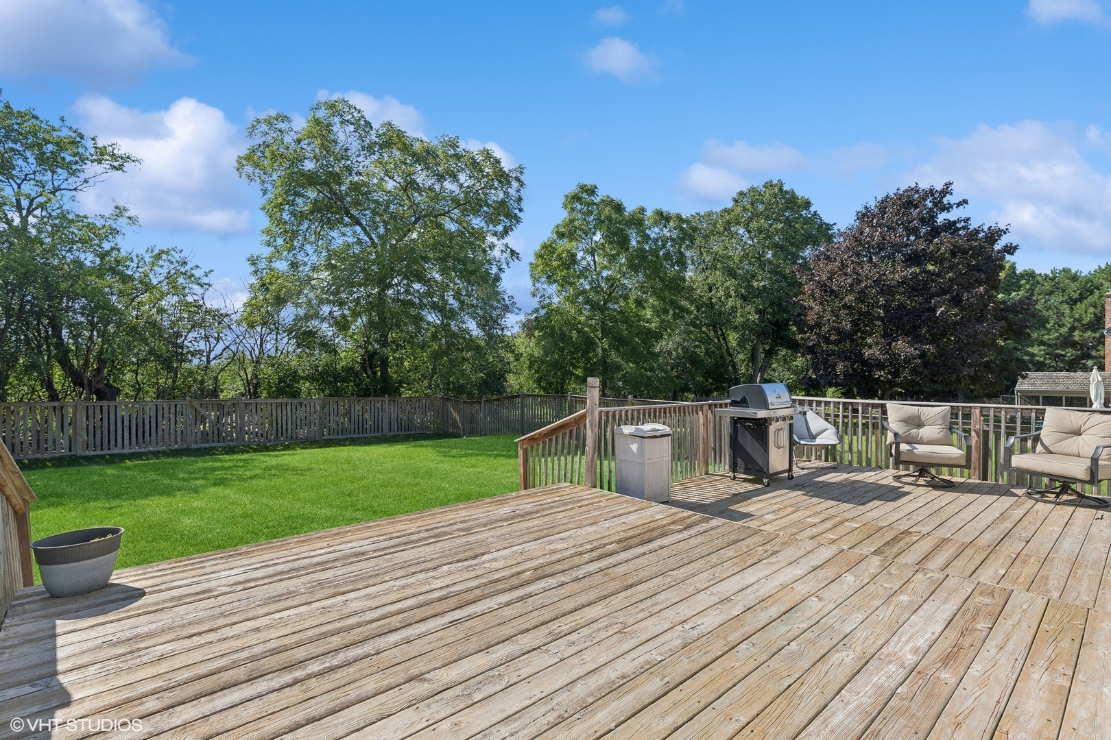 548 Long Hill Road Gurnee, IL 60031 - Photo 19 of 26 a view of a deck with chairs a barbeque with wooden floor and fence