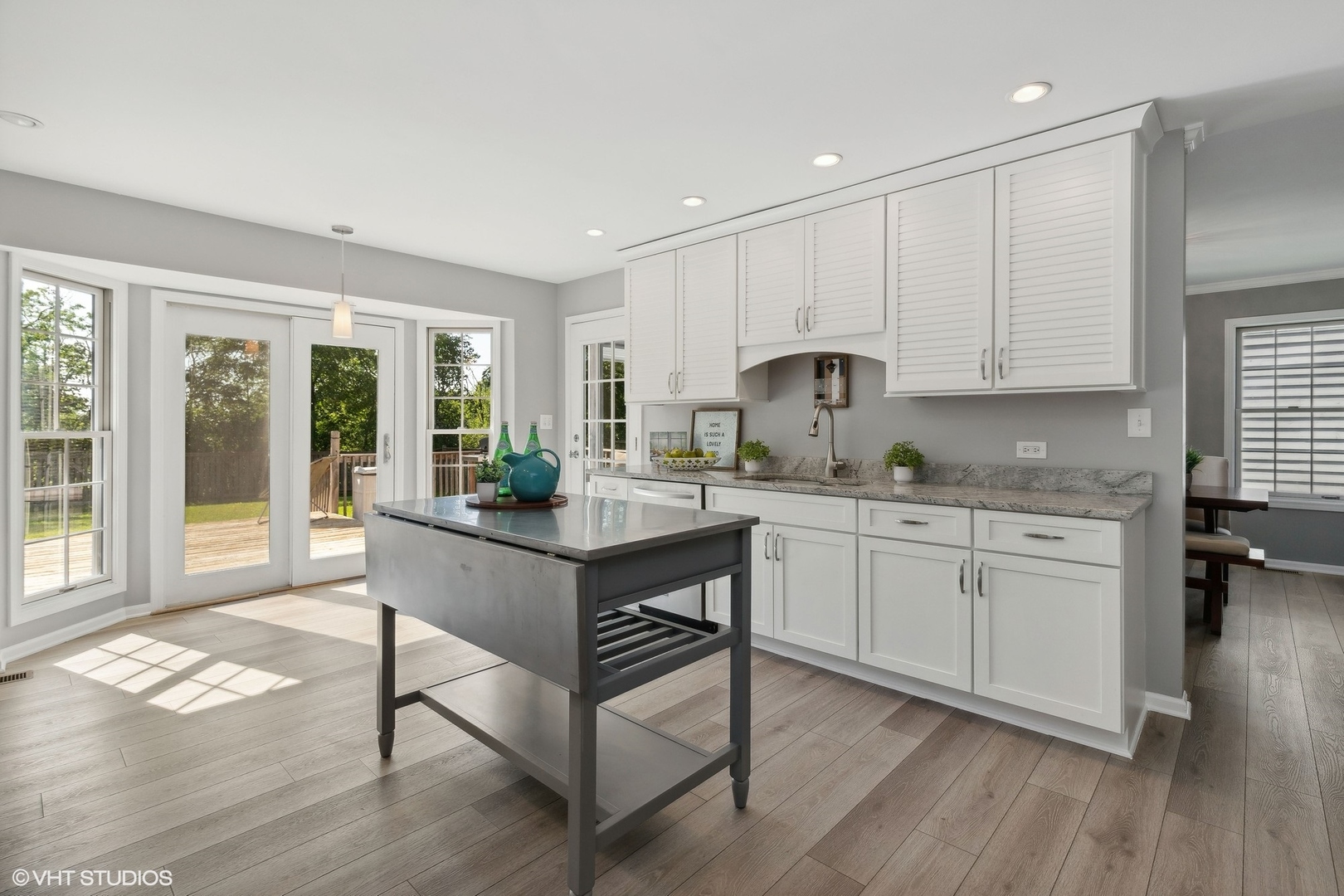 548 Long Hill Road Gurnee, IL 60031 - Photo 5 of 26 a kitchen with sink cabinets and wooden floor