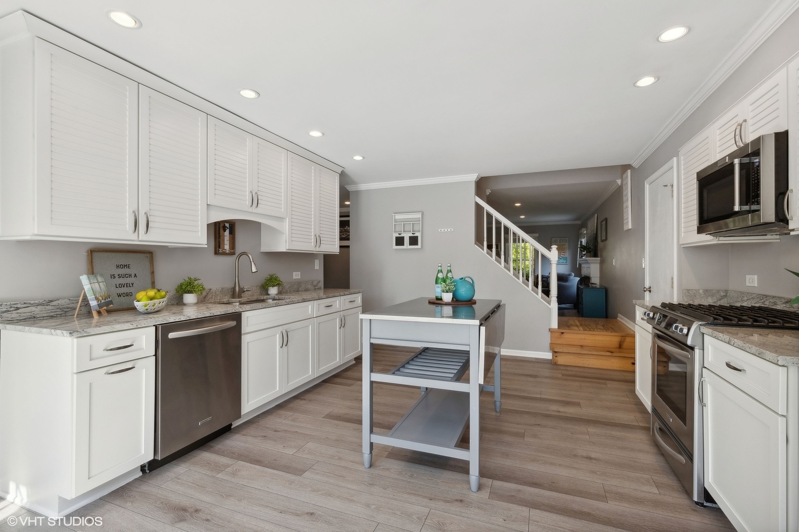 548 Long Hill Road Gurnee, IL 60031 - Photo 6 of 26 a kitchen with white cabinets and appliances