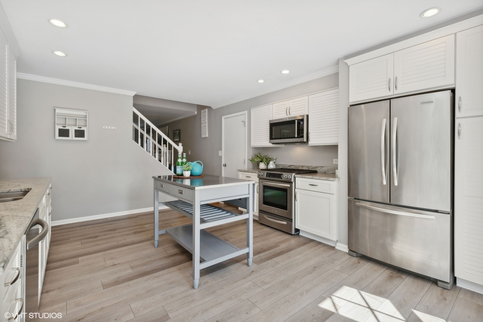 548 Long Hill Road Gurnee, IL 60031 - Photo 7 of 26 a kitchen with a refrigerator and a stove top oven