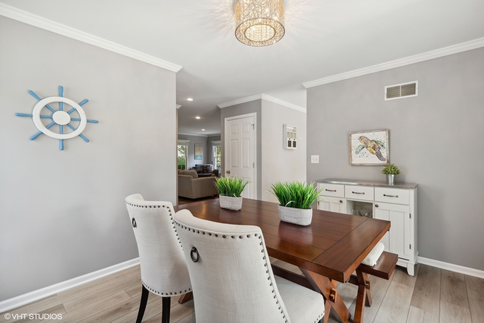 548 Long Hill Road Gurnee, IL 60031 - Photo 10 of 26 a view of a dining room with furniture wooden floor and a chandelier