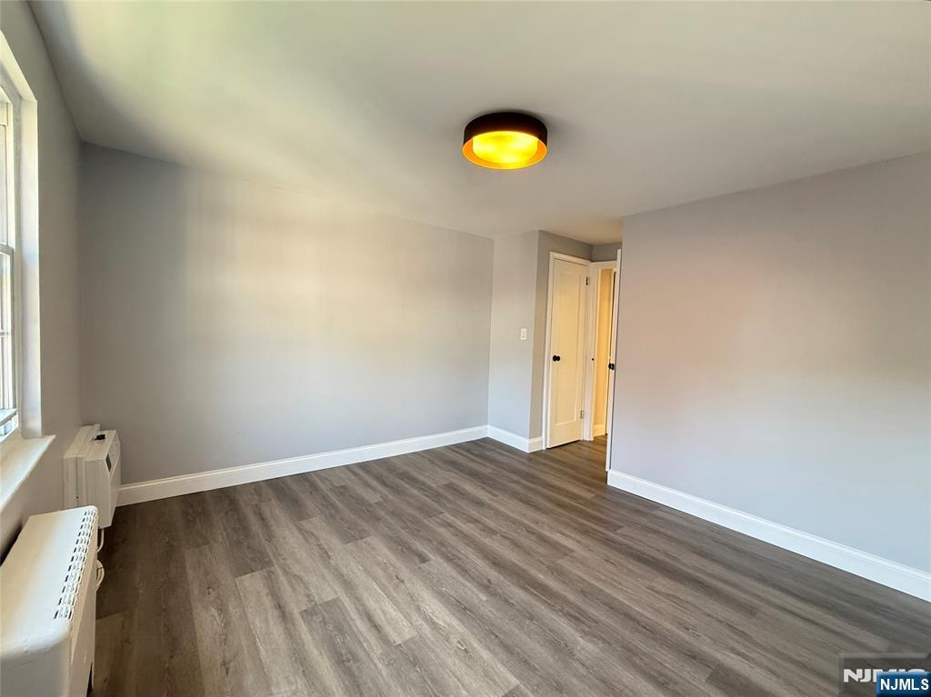 20 Clark Court Rutherford, NJ 07070 - Photo 17 of 29 a view of a room with wooden floor and window