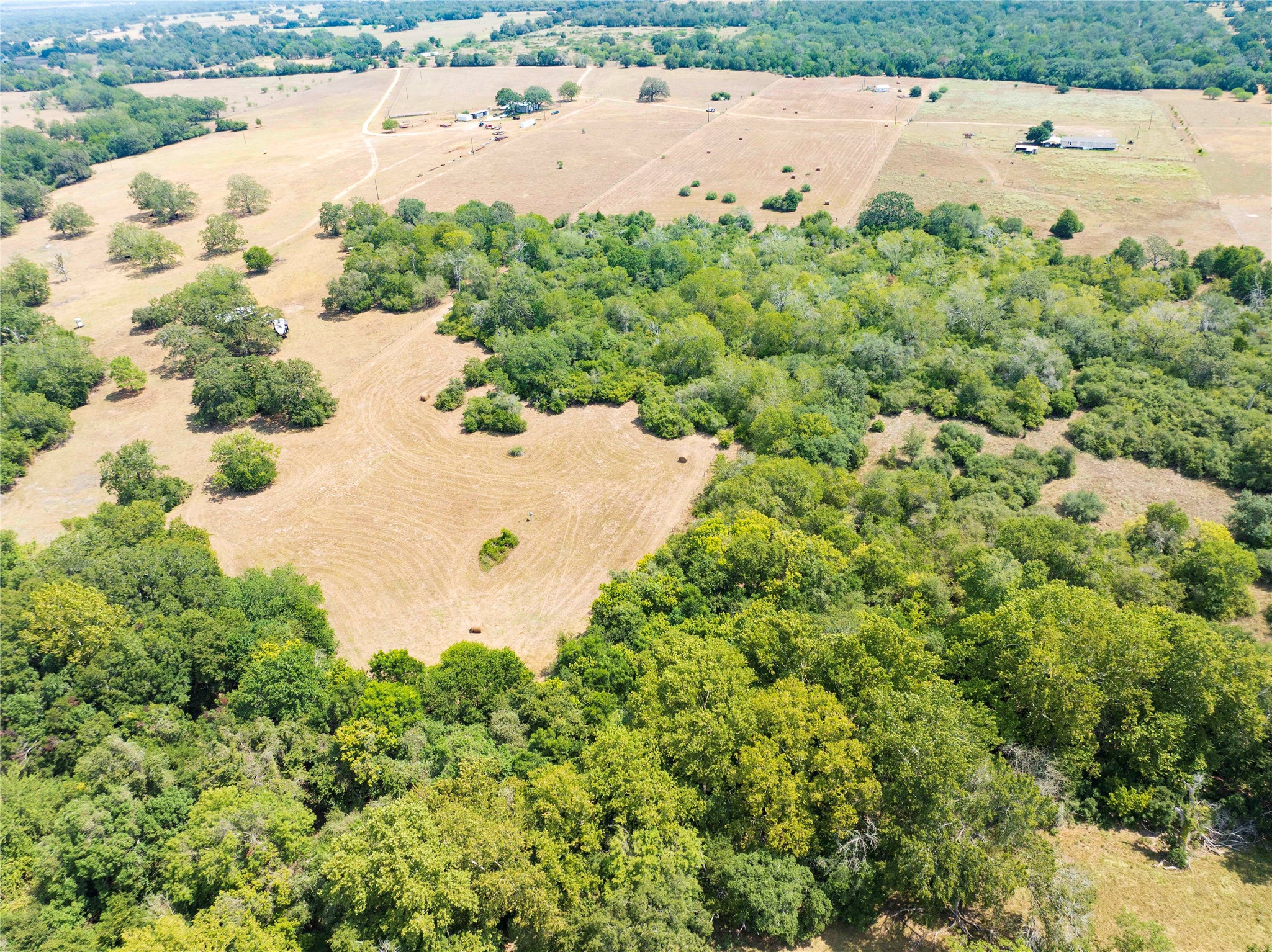 710 County Road 211 Hallettsville, TX 77964 - Photo 12 of 29 an aerial view of ocean with residential houses with outdoor space and trees all around