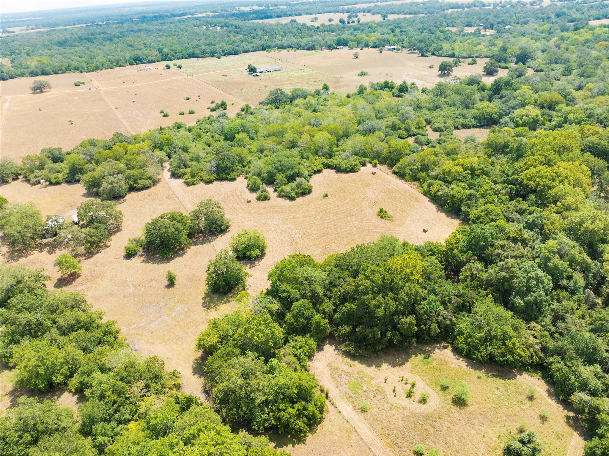 710 County Road 211 Hallettsville, TX 77964 - Photo 13 of 29 an aerial view of a house with a yard and lake view