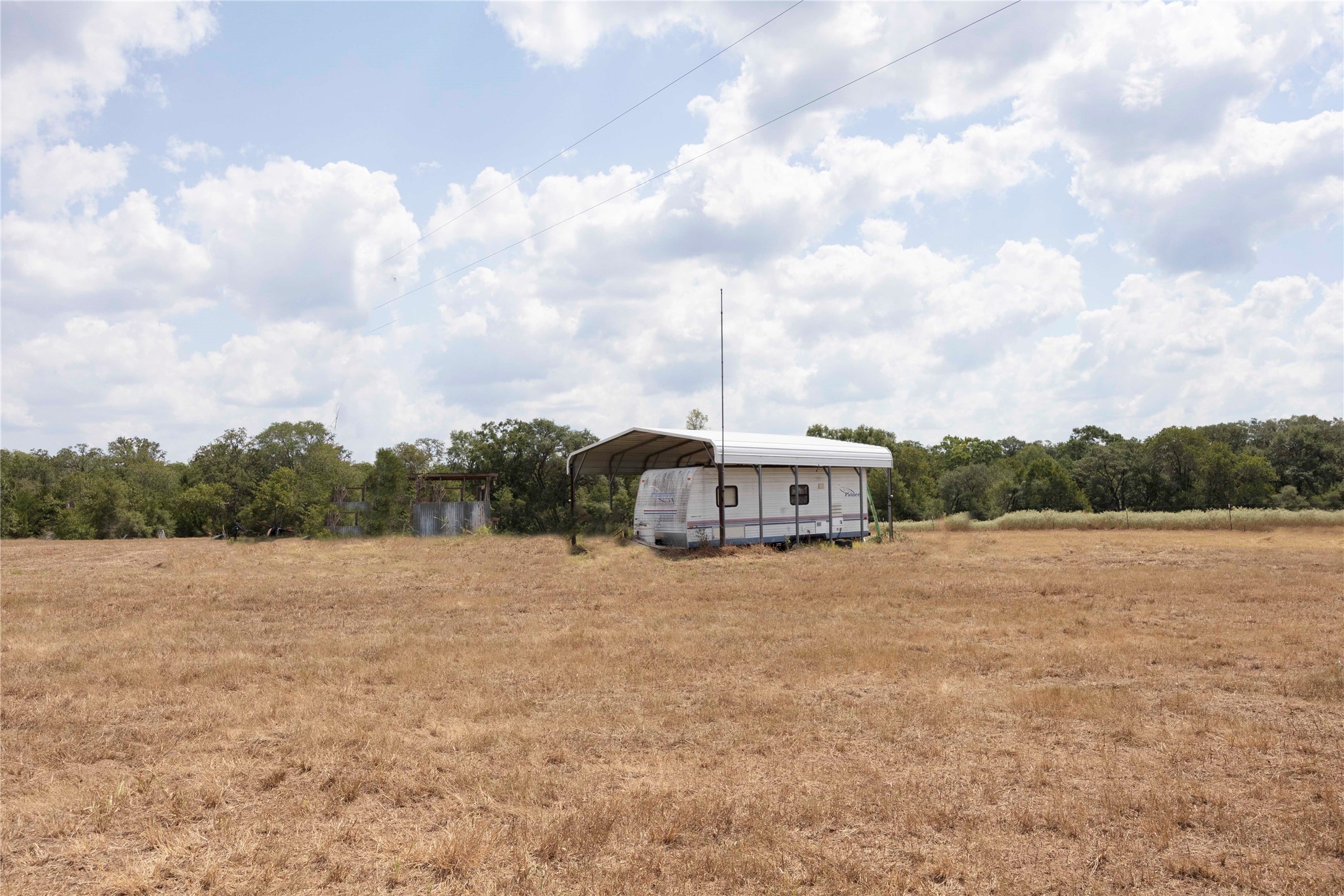 710 County Road 211 Hallettsville, TX 77964 - Photo 17 of 29 a view of an outdoor space and kitchen