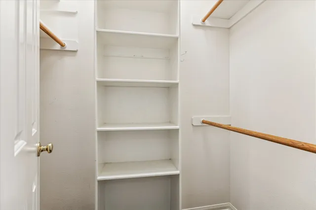 a view of an empty walk in closet