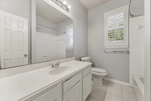 a bathroom with a sink toilet and vanity
