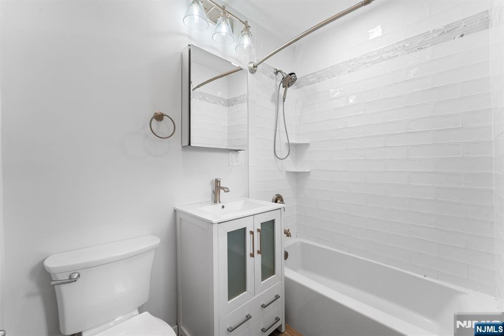 177 East Pierrepont Avenue Rutherford, NJ 07070 - Photo 19 of 27 a bathroom with a sink a toilet and shower